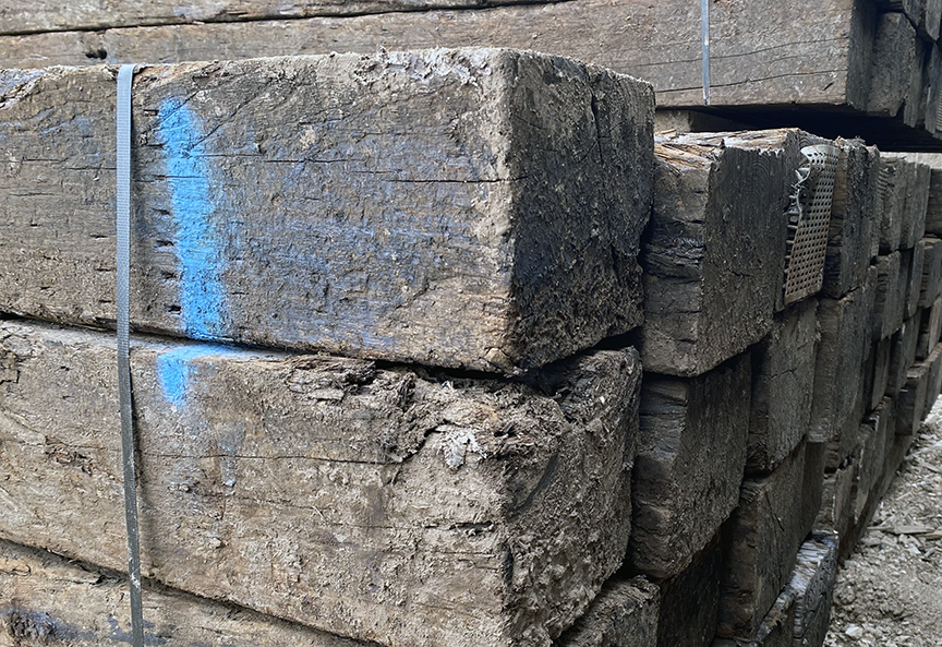Photo of used railroad ties. Page outlines where to purchase used railroad ties and what to do with them.